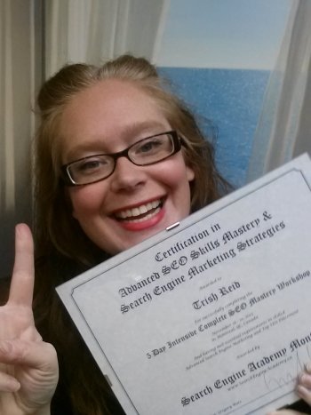 Trish happy SEO Grad Selflie with certificate